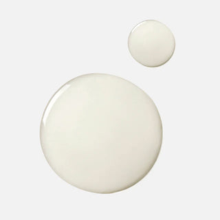 Face Reality L-Mandelic Serum texture drops – lightweight milky serum formula on light gray background