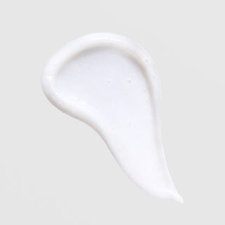 Face Reality Barrier Balance Creamy Cleanser texture swatch – soft white creamy formula on light gray background