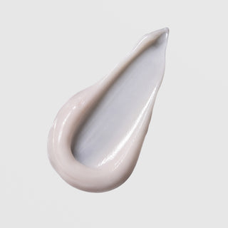Face Reality Cran-Peptide Cream texture swatch – rich pinkish-beige cream formula on light gray background