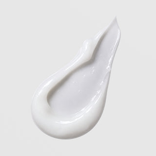 Face Reality HydraCalm Mask texture swatch – smooth glossy white cream formula on light gray background