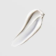 Face Reality Mineral Matte SPF 28 texture swatch – smooth white mineral sunscreen cream on gray background
