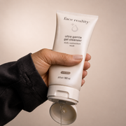 Hand dispensing Face Reality Ultra Gentle Gel Cleanser – lightweight daily antioxidant face wash, acne-safe for sensitive skin