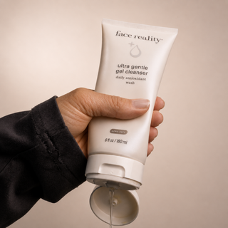 Hand dispensing Face Reality Ultra Gentle Gel Cleanser – lightweight daily antioxidant face wash, acne-safe for sensitive skin