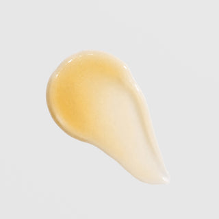Face Reality glowTone Corrective Serum texture swatch – lightweight golden gel with shimmering finish on white background
