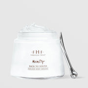 Farmhouse Fresh Moon Dip Back to Youth Ageless Body Mousse in an open white glass jar overflowing with whipped white mousse, displayed alongside a silver spatula against a light gray background.