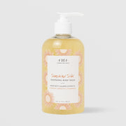 Farmhouse Fresh Sunshine Silk Soothing Body Wash (12 fl oz / 355 ml) in a clear pump bottle with a golden yellow formula and a sunburst-patterned label, formulated with vitamin E, green tea, and chamomile, displayed against a light gray background.