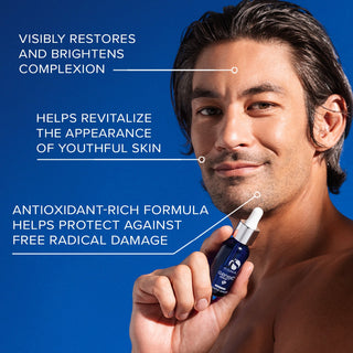 Man with glowing skin holding iS Clinical GeneXC Serum on blue background with benefits: visibly restores and brightens complexion, revitalizes youthful skin appearance, and antioxidant-rich formula protects against free radical damage