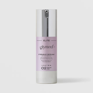 GlyMed Plus Elite Firming Serum with Phyto-Stem Cells in white pump bottle with silver pump and lavender label, 1.0 oz, on light gray background