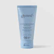 GlyMed Plus Hydrating Masque with Enzymes in light blue squeeze tube, 2.0 oz, on light gray background