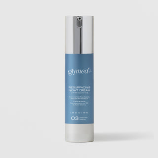 GlyMed Plus Resurfacing Night Cream with 15% Glycolic Acid in white pump bottle with silver pump and blue label, 1.69 oz, on light gray background