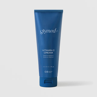 GlyMed Plus Vitamin C Cream in navy blue squeeze tube, 2.0 oz, on light gray background