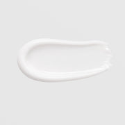 GlyMed Plus Clear Skin Cleanser with Benzoyl Peroxide texture swatch showing creamy white cleanser consistency on light gray background