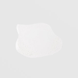 GlyMed Plus Daily Skin Clarifier texture swatch showing lightweight foamy white lotion consistency on light gray background