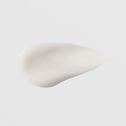 GlyMed Plus Essential Serum with Amino Acids texture swatch showing lightweight, smooth whitish serum consistency on light gray background