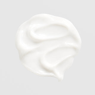 GlyMed Plus Eye Calm soothing eye cream swatch showing smooth, silky white cream texture on light gray background