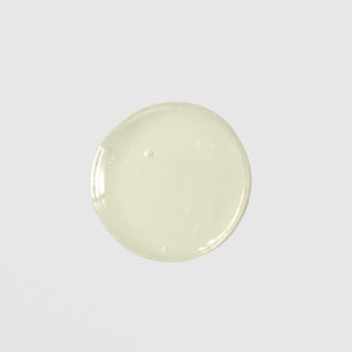 GlyMed Plus Firming Serum translucent pale green gel texture swatch showing lightweight glossy consistency on grey background