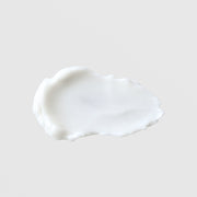 GlyMed Plus Oxygen Cream opaque white rich cream texture swatch with ruffled edges showing thick whipped consistency on grey background