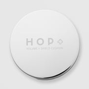 HOP+ Volume Shield Cushion closed silver chrome compact with engraved HOP+ Volume Shield Cushion branding on lid