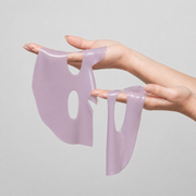 House of PLLA Volume Boost Volumizing Hydrogel Mask with PDRN - lavender hydrogel mask held in hands showing texture and flexibility