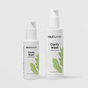 Hale & Hush Clarify Wash renew and revive facial cleanser shown in two sizes, 3.4 oz and 6.5 oz white pump bottles with green leaf botanical design, on a light gray background