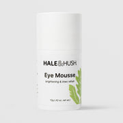 Hale & Hush Eye Mousse 12g airless pump bottle with cap on, green botanical feather and leaf graphics, labeled brightening and lines rehab