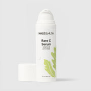 Hale & Hush Rare C Serum radiance and pore rehab vitamin C serum in a white airless pump bottle with cap removed and green leaf botanical design, 50ml / 1.69 fl oz, on a light gray background
