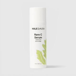 Hale & Hush Rare C Serum radiance and pore rehab vitamin C serum in a white airless pump bottle with cap on and green leaf botanical design, 50ml / 1.69 fl oz, on a light gray background