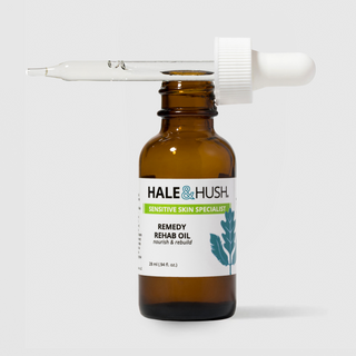 Hale & Hush Sensitive Skin Specialist Remedy Rehab Oil nourish and rebuild facial oil in an amber glass bottle with dropper resting open at an angle, 28ml / 0.94 fl oz, on a light gray background