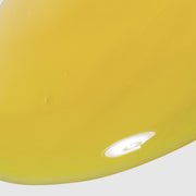 Close-up of Hale & Hush Rare Retinal Serum showing a smooth, golden-yellow serum texture on a light gray background