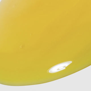 Close-up of Hale & Hush Rare Retinal Serum showing a smooth, golden-yellow serum texture on a light gray background