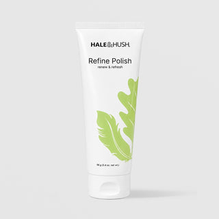 A white squeeze tube of HALE & HUSH Refine Polish with green leaf graphics, centered on a light gray background.