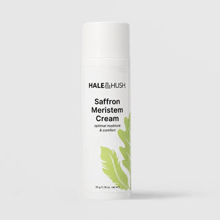 Hale & Hush Saffron Meristem Cream optimal moisture and comfort moisturizer in a white airless pump bottle with cap on and green leaf botanical design, 50g / 1.76 oz, on a light gray background
