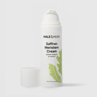 Hale & Hush Saffron Meristem Cream optimal moisture and comfort moisturizer in a white airless pump bottle with cap removed and green leaf botanical design, 50g / 1.76 oz, on a light gray background