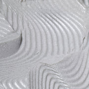 Macro closeup of Hale & Hush Charcoal Clarifying Mask showing smooth gray clay texture with charcoal flecks and swirled ridges