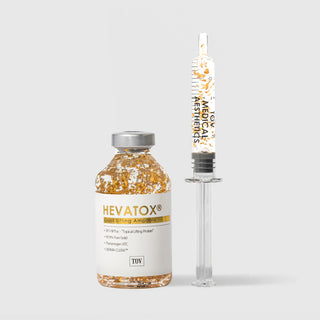 Hevatox Gold Lifting Ampoule vial and syringe applicator with 99.9% pure gold flakes, SP1-NPTox topical lifting protein, Theramogen ATC, and DERMA-CLERA by TOV Medical Aesthetics