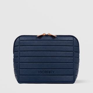 Hydrinity navy ribbed cosmetic bag with rose gold zippers from the Wrapped in Radiance Collection