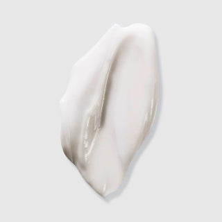 Hydrinity Encore Body Hydrator texture swatch showing rich white moisturizing body cream formula on grey background.