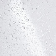 Hydrinity Hyacyn Active Purifying Mist texture close-up showing ultra-fine clear water droplets on light gray surface.