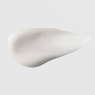 Hydrinity Renewing HA Serum texture swatch showing smooth creamy white hyaluronic acid serum formula on grey background.