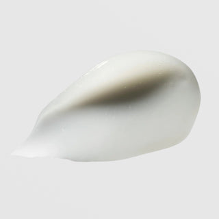 Hydrinity Restorative HA Serum texture swatch showing silky white hyaluronic acid serum formula on grey background.