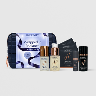 Hydrinity Wrapped in Radiance Collection holiday set, a $235 value, with navy cosmetic bag and 5 skincare products
