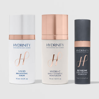 Hydrinity three-piece skincare set with Vivid Brightening Serum 15ml, Hydri-C Daily Vitamin C Moisturizer 15ml, and RetaXome Daily Retinal Hydrator 5ml