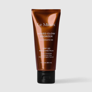 Le Mieux Naked Glow Bronzer Illuminate Me Broad Spectrum SPF 50 tinted bronzing lotion 1.7 fl oz 50 ml metallic bronze tube. Full coverage mineral-based sunscreen dermatologist tested. Available at Art of Skin Care