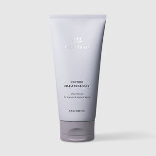 Le Mieux Peptide Foam Cleanser silky facial cleanser for dryness and signs of aging 6 fl oz 180 ml lavender grey tube with matching grey flip cap. Available at Art of Skin Care