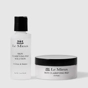 Le Mieux Skin Clarifying Pad exfoliate and balance system including 2 oz 56 ml solution in white pump bottle and black and white jar containing 30 Skin Clarifying Pads. Available at Art of Skin Care
