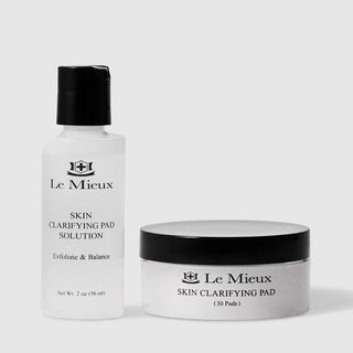 Le Mieux Skin Clarifying Pad exfoliate and balance system including 2 oz 56 ml solution in white pump bottle and black and white jar containing 30 Skin Clarifying Pads. Available at Art of Skin Care