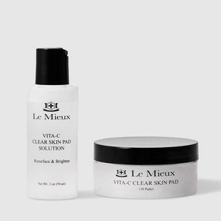 Le Mieux Vita-C Clear Skin Pad resurface and brighten vitamin C exfoliating pad system including 2 oz 56 ml solution in white pump bottle and jar of 30 pre-soaked exfoliating pads. Available at Art of Skin Care