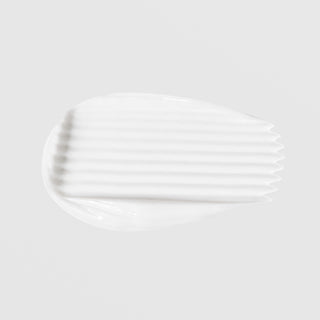Le Mieux 24 Hour Age Defying Cream texture swatch showing rich thick white cream formula on grey background.