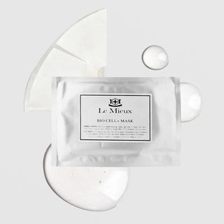 Le Mieux Bio Cell+ Mask single foil packet with sheet mask and serum droplets on grey background.