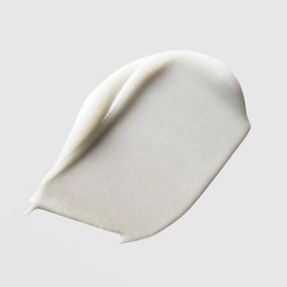 Le Mieux Eye Wrinkle Corrector texture swatch showing rich white cream formula on grey background.